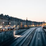 Traffic and lights in street at dusk. Bordeaux