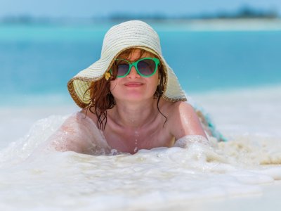Young woman on the caribbean beach in Cuba