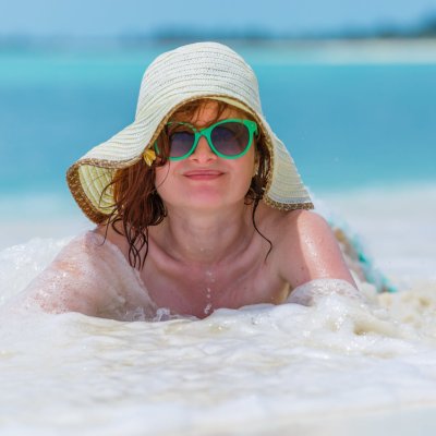 Young woman on the caribbean beach in Cuba