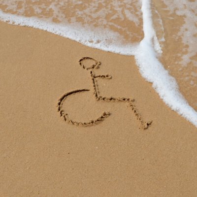 Symbol for disabled is drawn in the sand at the beach