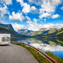 Family vacation travel RV, holiday trip in motorhome, Caravan car Vacation. Beautiful Nature Norway natural landscape.