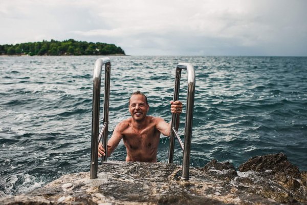Man swimming in the Mediterranean sea croatia